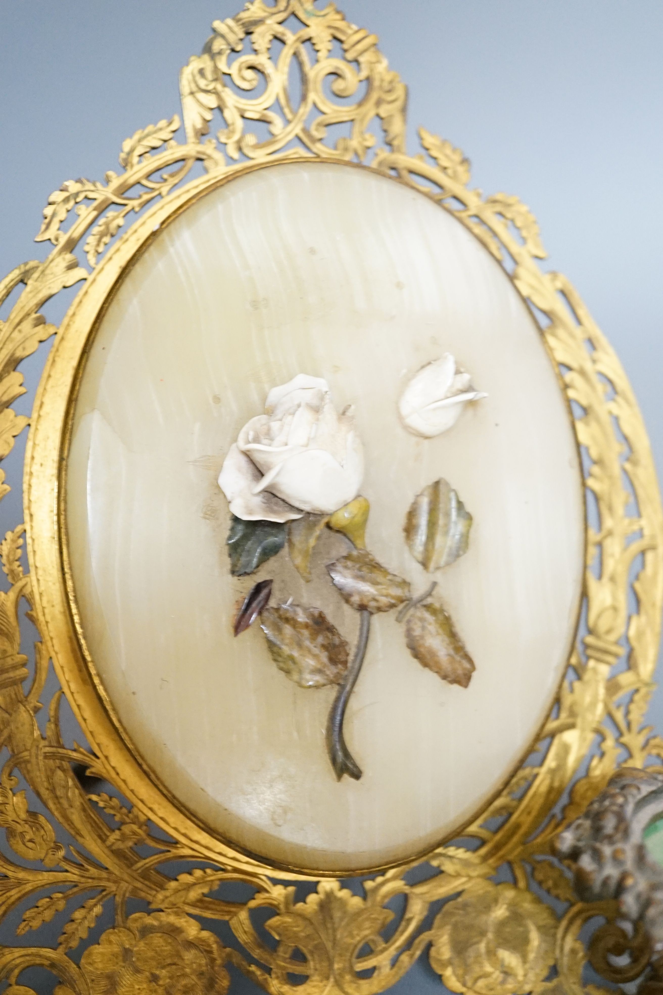 An ormolu and hardstone mounted easel double photo frame, a glass and brass chamberstick, a Venice enamel chamberstick etc.